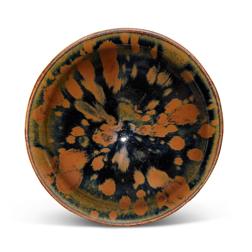 View full screen - View 1 of Lot 5017. A superb Henan russet-splashed blacked-glazed 'partridge feather' temmoku bowl, Northern Song dynasty 北宋 河南窰鷓鴣斑斗笠盞.