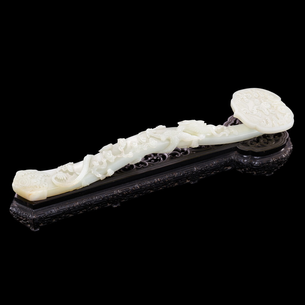 View full screen - View 1 of Lot 3603. An exceptional imperial inscribed white jade ruyi sceptre Mark and period of Qianlong, dated to the renchen year, corresponding to 1772 | 清乾隆 御製白玉趕珠雲龍紋題詩如意 《乾隆壬辰新春御題》款 「比德」、「朗潤」印.