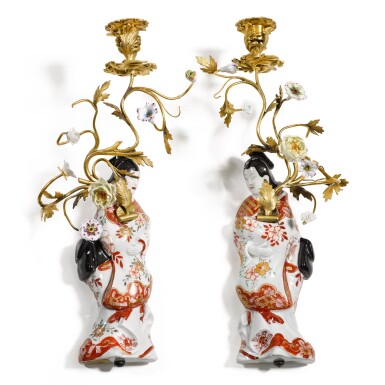 View full screen - View 1 of Lot 40. A pair of Japanese porcelain figural wall flower holders, with later porcelain flower mounted bronze branches, the Japanese porcelain 18th century, the gilt-bronze and flowers 19th century.