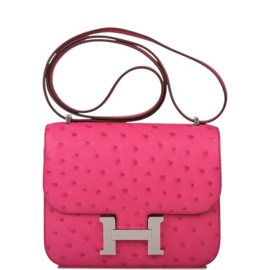 View full screen - View 1 of Lot 64. HERMÈS | ROSE TYRIEN CONSTANCE 18CM IN OSTRICH WITH PALLADIUM HARDWARE.