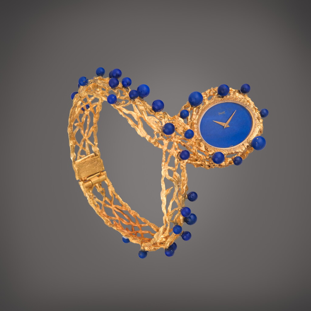 View full screen - View 1 of Lot 42. Reference 9850 | A rare yellow gold openwork bracelet watch with lapis lazuli dial and beads, Circa 1970.