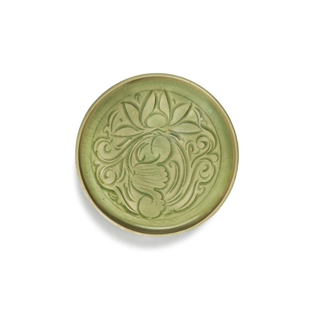 View full screen - View 1 of Lot 95. A carved 'Yaozhou' celadon-glazed dish, Northern Song / Jin dynasty | 北宋 / 金 耀州窰青釉刻蓮紋盤.