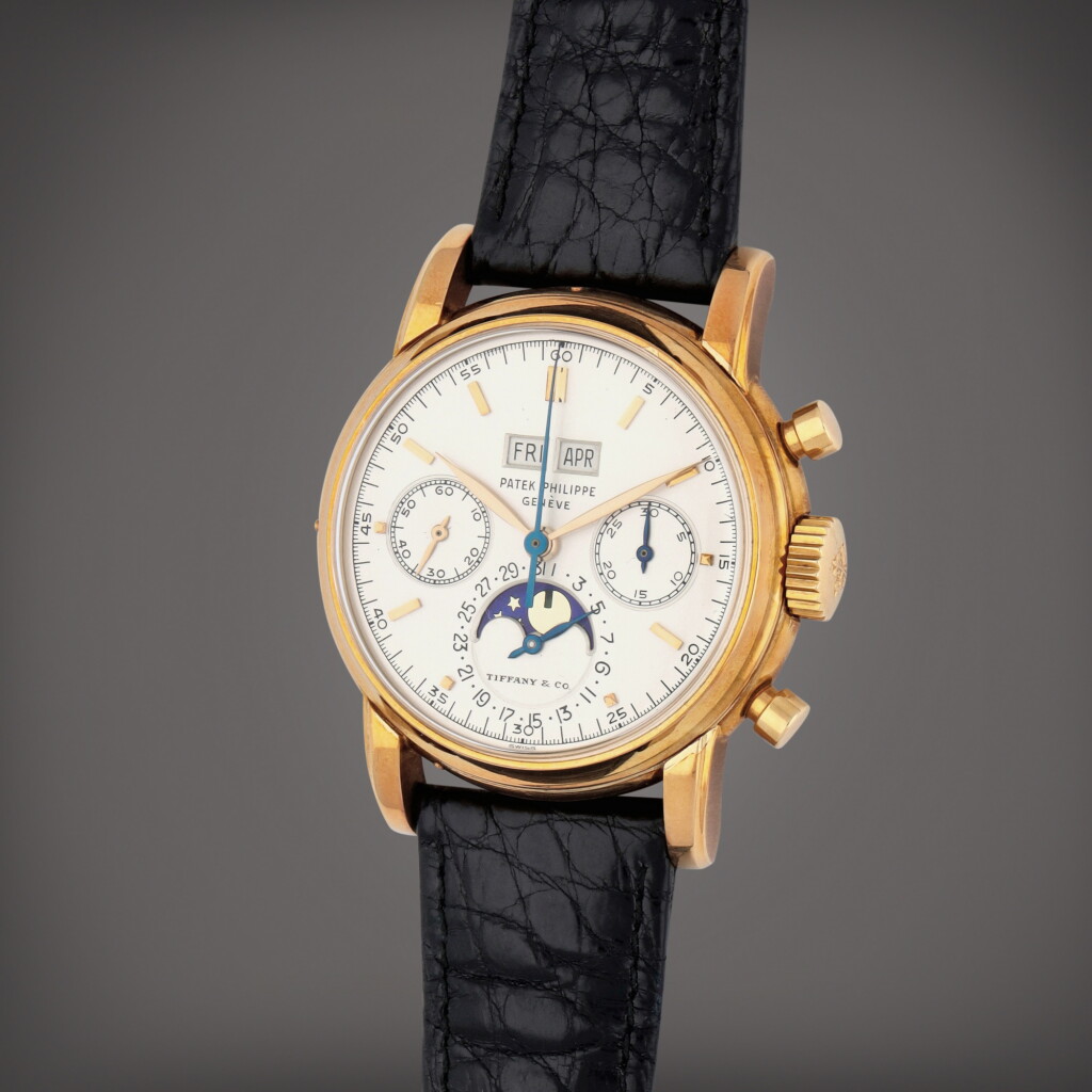 View full screen - View 1 of Lot 97. Retailed by Tiffany & Co.: '3rd Series', Reference 2499J | A yellow gold perpetual calendar chronograph wristwatch with moon phases | Circa 1964.