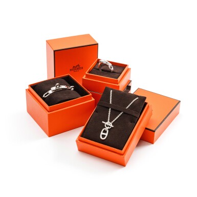 View full screen - View 1 of Lot 394. Set of Three: Silver Double Kelly Chaine Bracelet, Pedentif Chaine d'ancre and Bague Galop.