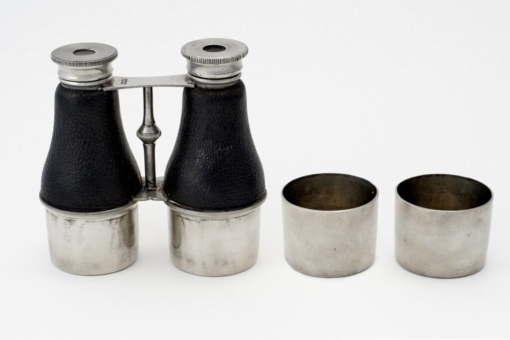 View full screen - View 1 of Lot 33. AN ENGLISH SILVER-PLATED BINOCULAR-FORM DOUBLE SPIRIT FLASK.