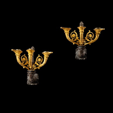 View full screen - View 1 of Lot 244. A pair of patinated and gilt-bronze three-light wall lights, Louis Philippe, circa 1840 Paire d'appliques à trois lumières en bronze patiné et doré d'époque Louis Philippe, vers 1840.