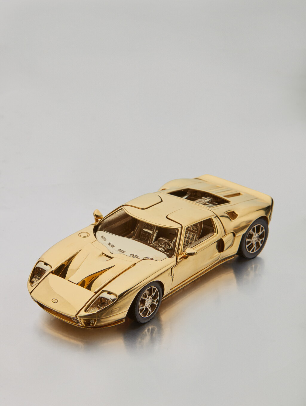 View full screen - View 1 of Lot 1. Property of a Descendant of Henry Ford | Eighteen-Karat Two-Tone Gold 2006 Ford GT 1/25 Scale Model.