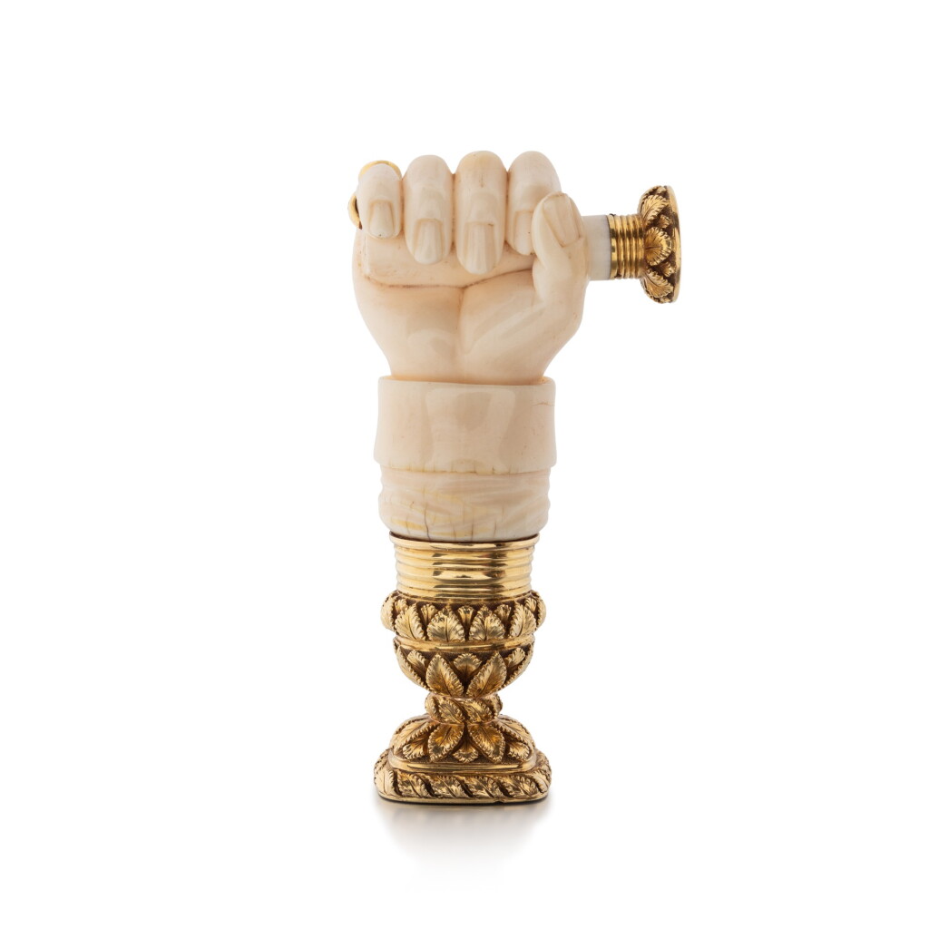 View full screen - View 1 of Lot 1147. A George IV ivory hand-seal with gold mounts, England, circa 1820.
