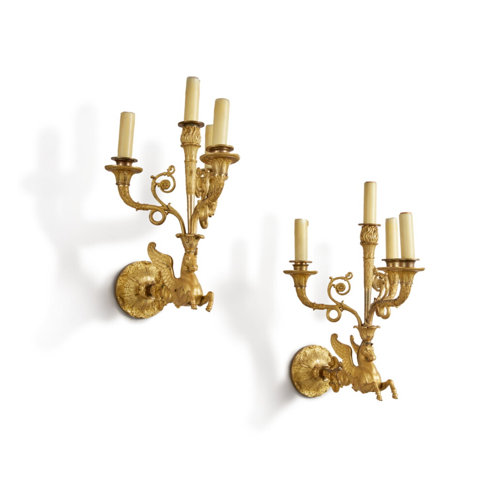 View full screen - View 1 of Lot 825. A PAIR OF EMPIRE GILT-BRONZE FOUR-BRANCH WALL LIGHTS, CIRCA 1810.