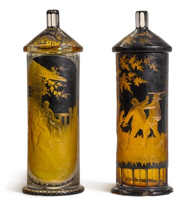 View full screen - View 1 of Lot 139. Two Bohemian amber-stained, enamelled and engraved glass vases and covers, circa 1910.