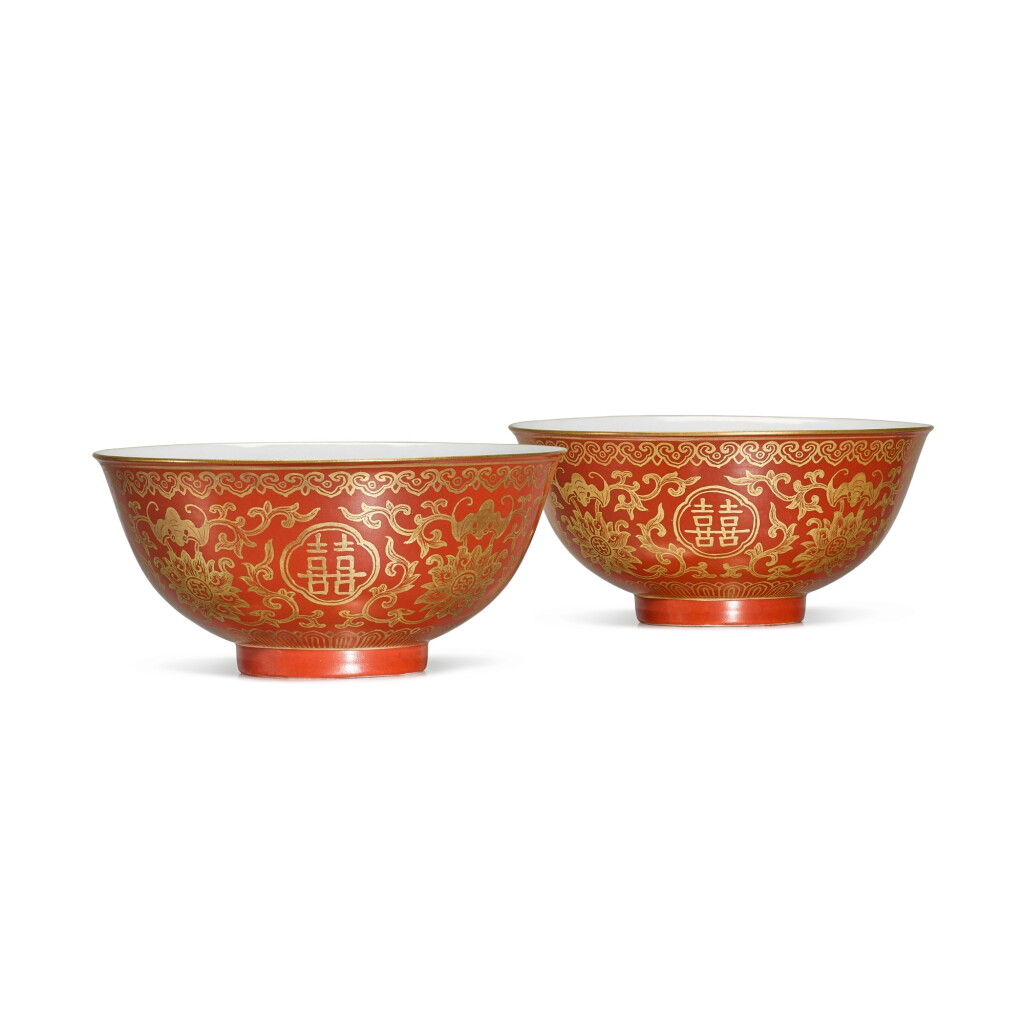 View full screen - View 1 of Lot 23. A fine and rare pair of coral-ground gilt-decorated 'lotus and bats' bowls, Seal marks and period of Jiaqing.