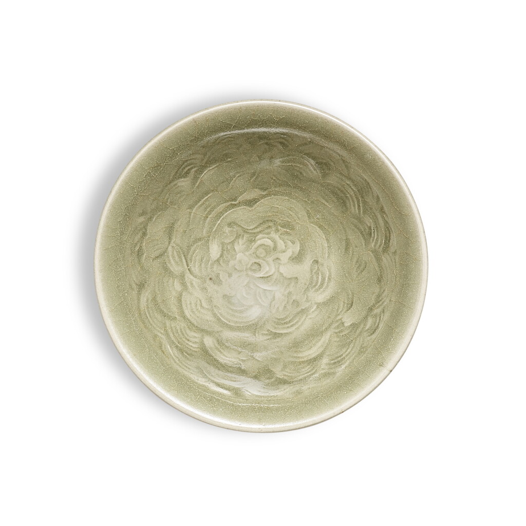 View full screen - View 1 of Lot 3522. An unusual moulded Yue celadon 'makara' cup, Northern Song dynasty | 北宋 越窰青釉印摩羯紋盃.
