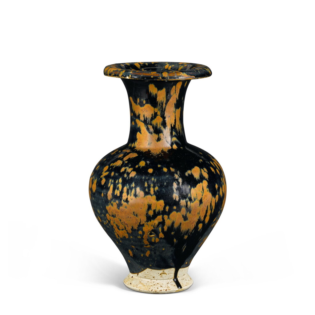 View full screen - View 1 of Lot 114. A superb and rare Cizhou russet-splashed black-glazed 'partridge feather' vase, Northern Song dynasty | 北宋 磁州窰黑釉鐵鏽飛斑卷口瓶.