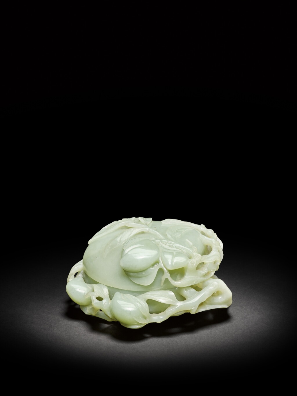 View full screen - View 1 of Lot 27. A large pale celadon jade peach-shaped box and cover, Qing dynasty, Qianlong period | 清乾隆 青白玉桃式蓋盒.