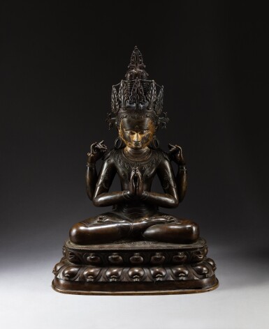 View full screen - View 1 of Lot 131. A copper-alloy figure of Sadaksari Avalokitesvara Central Tibet, ca. 14th century | 西藏 約十四世紀 局部鎏金銅合金四臂觀世音菩薩坐像.