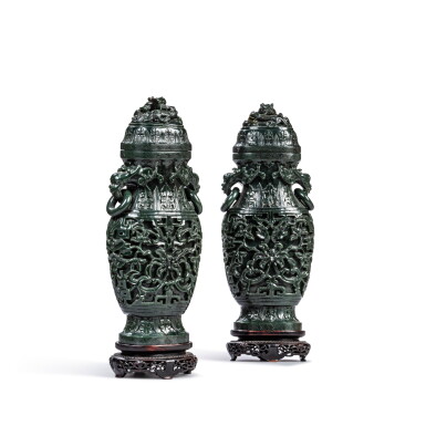 View full screen - View 1 of Lot 600. A pair of dark green jade vases and covers, 20th century.