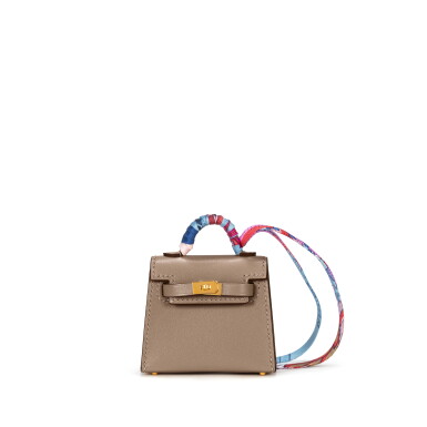 View full screen - View 1 of Lot 1010. Etoupe Tadelakt Micro Mini Kelly Twilly Bag Charm Gold Hardware, 2021.