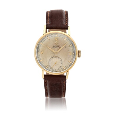 View full screen - View 1 of Lot 240. Retailed by Tiffany & Co.: A yellow gold wristwatch, Circa 1945.
