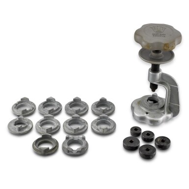 View full screen - View 1 of Lot 8084. Easy Oyster Opener, Reference 1001 | A steel case opener with 11 cast for various case size, 5 adaptors for various case back sizes and original fitted box, Circa 1955 | 勞力士 | Easy Oyster Opener 型號1001 | 精鋼錶蓋工具,附帶盒子,約1955年製.