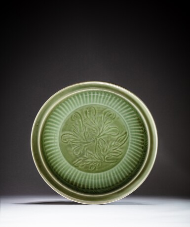 View full screen - View 1 of Lot 40. A flutted 'Longquan' celadon-glazed 'flower' charger, Yuan dynasty | 元 龍泉窰青釉花卉紋折沿大盤.