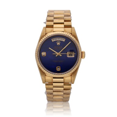 View full screen - View 1 of Lot 418. Reference 18238 Day-Date | A yellow gold wristwatch with day, date, bracelet and lapis lazuli dial, Circa 1994.