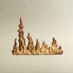 A deer antler carved 'scholar's rock' brush rest, Qing dynasty, 18th - 19th century | 清十八至十九世紀 鹿角雕賞石形筆擱