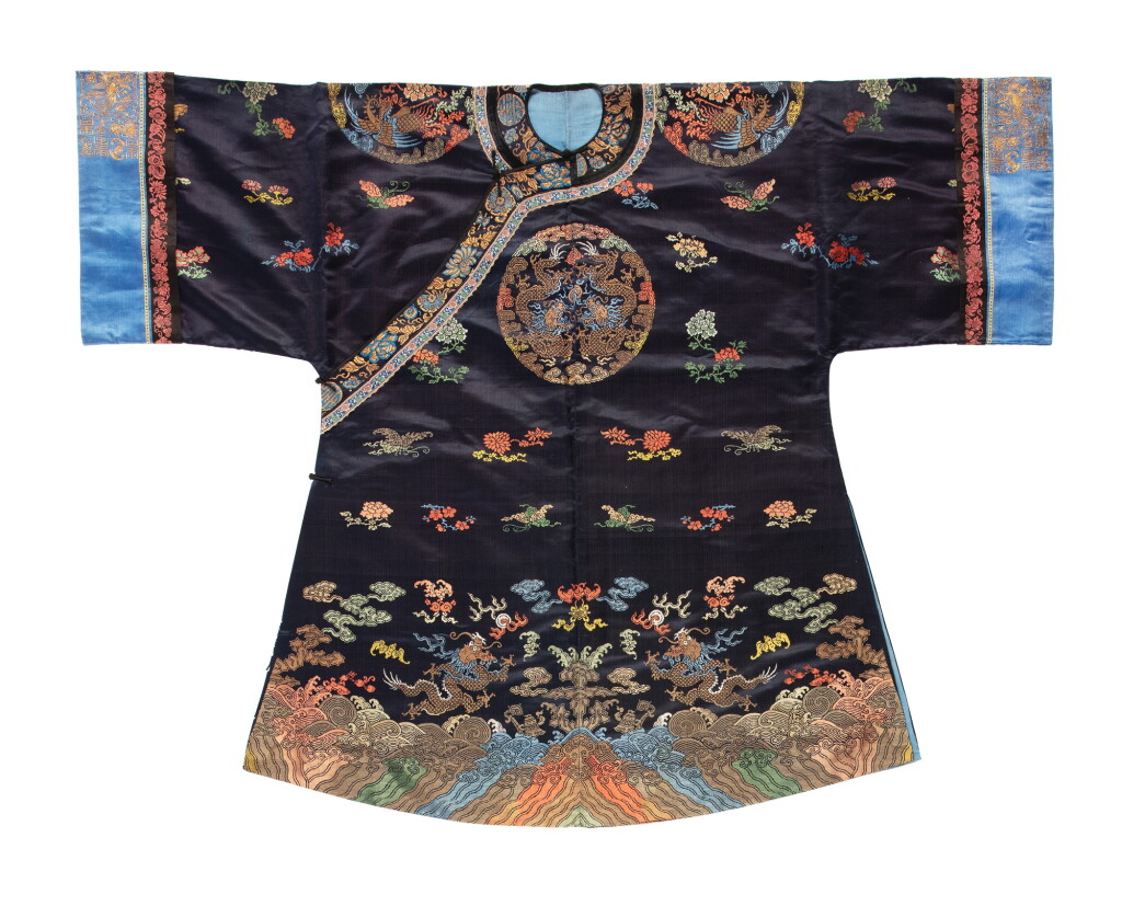 View full screen - View 1 of Lot 1056. A BLUE-GROUND SILK BROCADE LADY’S INFORMAL COURT ROBE, LATE QING DYNASTY.