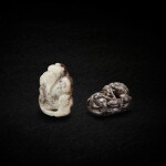 A greyish-white jade 'dragon king' and a greyish-white jade 'dragon' finial, Ming dynasty 明 灰白玉龍王一件及灰白玉龍鈕一件