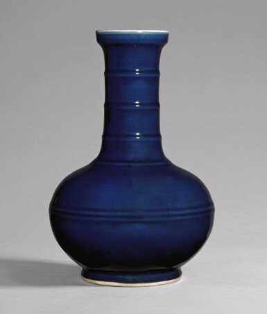 View full screen - View 1 of Lot 44. A BLUE-GLAZED RIBBED VASE, QING DYNASTY, 18TH CENTURY | 清十八世紀 霽藍釉弦紋長頸瓶.
