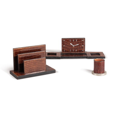 View full screen - View 1 of Lot 33. A crocodile skin, ebony and silver-plated desk nécessaire by Maison Hermès, Paris, 20th century Nécessaire de bureau en cuir de crocodile, ébène et métal argenté par Maison Hermès, Paris, XXe siècle.
