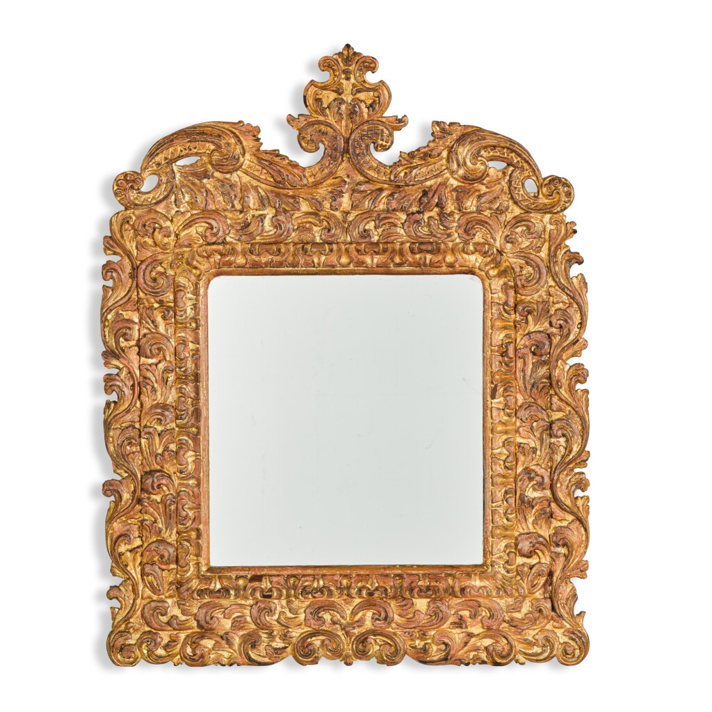 View full screen - View 1 of Lot 128. A SPANISH COLONIAL CARVED GILTWOOD MIRROR, FIRST HALF 18TH CENTURY.