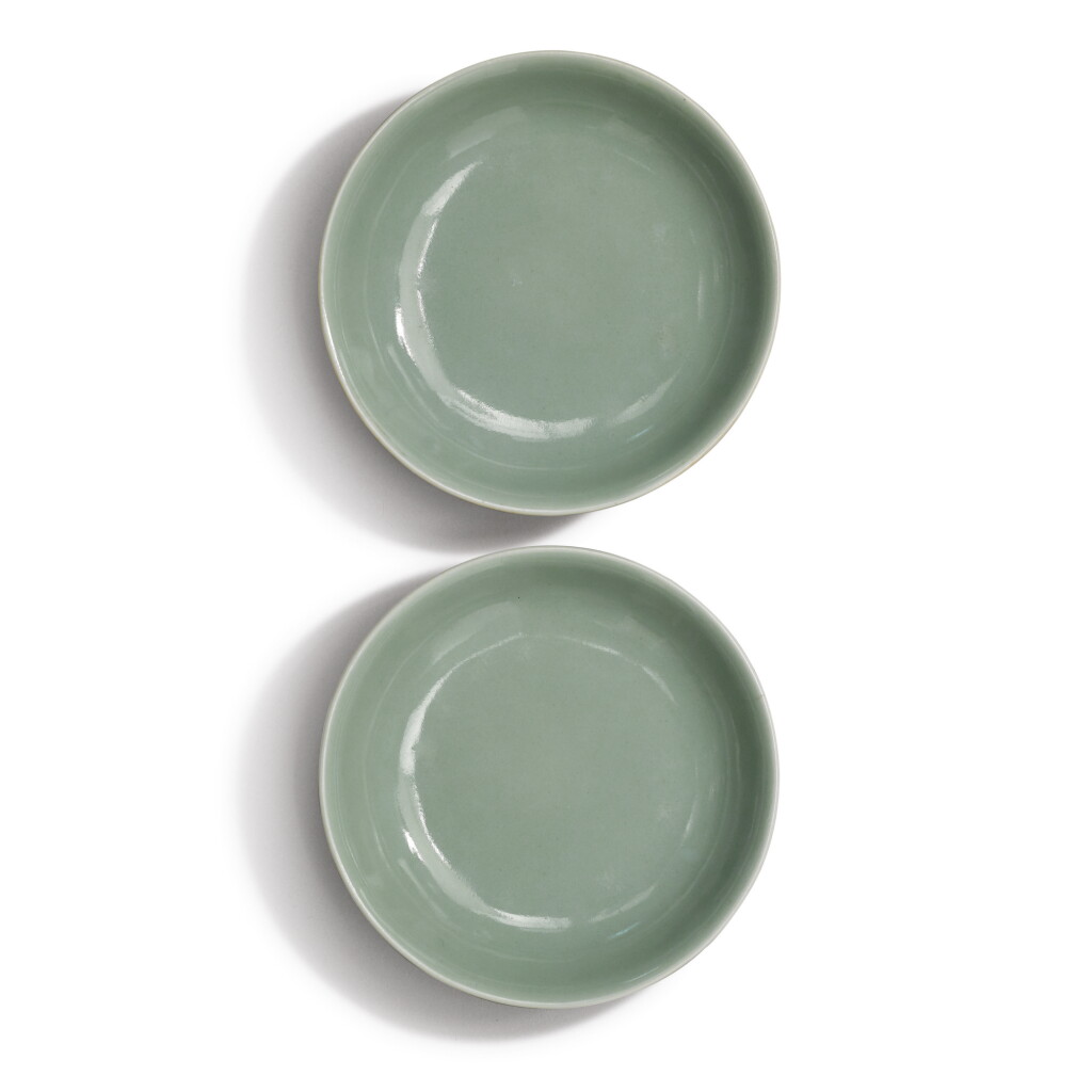 View full screen - View 1 of Lot 953. A PAIR OF SMALL CELADON-GLAZED DISHES, QING DYNASTY, 18TH / 19TH CENTURY.