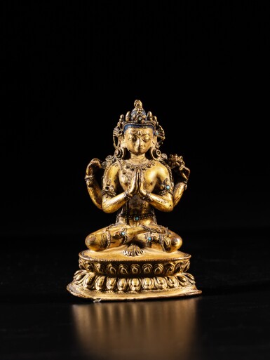 View full screen - View 1 of Lot 5. A gilt-copper figure of Avalokiteshvara Sadaksari, Tibet, 15th century | 十五世紀 藏傳鎏金銅觀音菩薩坐像.