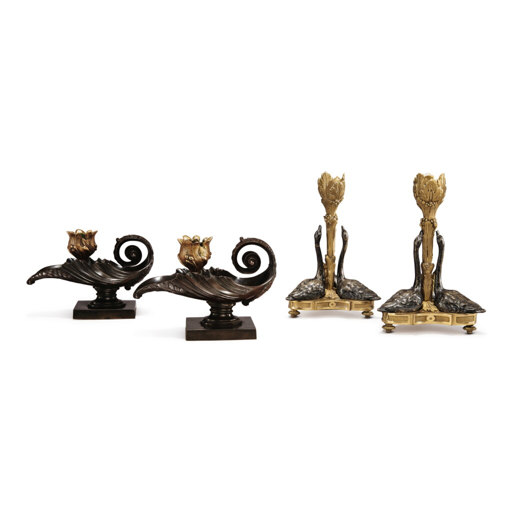 View full screen - View 1 of Lot 596. A PAIR OF LOUIS XVI STYLE GILT AND PATINATED BRONZE TRIPLE-SWAN CANDLESTICKS, TOGETHER WITH A PAIR OF LOUIS XV STYLE GILT AND PATINATED BRONZE CHAMBER CANDLESTICKS.