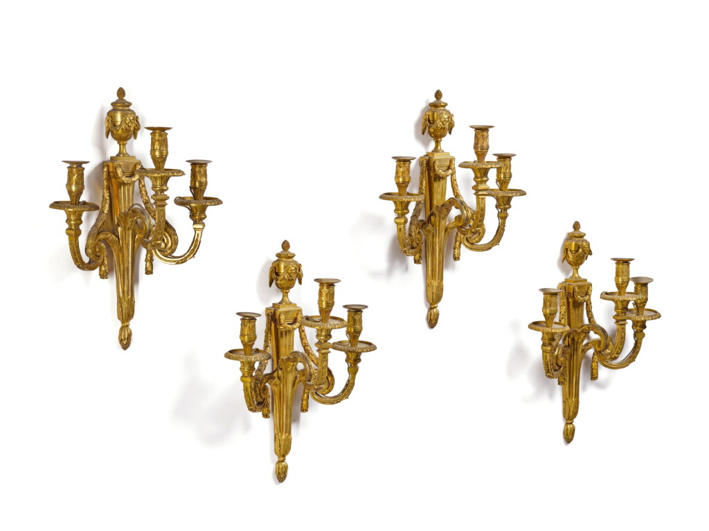 View full screen - View 1 of Lot 42. A set of four Louis XVI gilt-bronze two-light wall appliques, circa 1770.