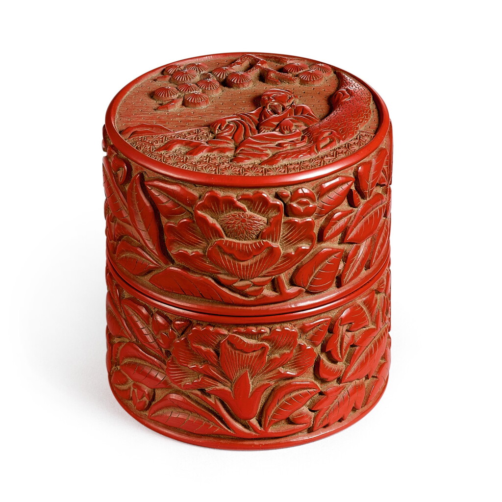 View full screen - View 1 of Lot 514. A cinnabar lacquer 'scholar under pine' cylindrical box and cover Ming dynasty, 15th - 16th century | 明十五至十六世紀 剔紅松下高仕圖蓋盒.