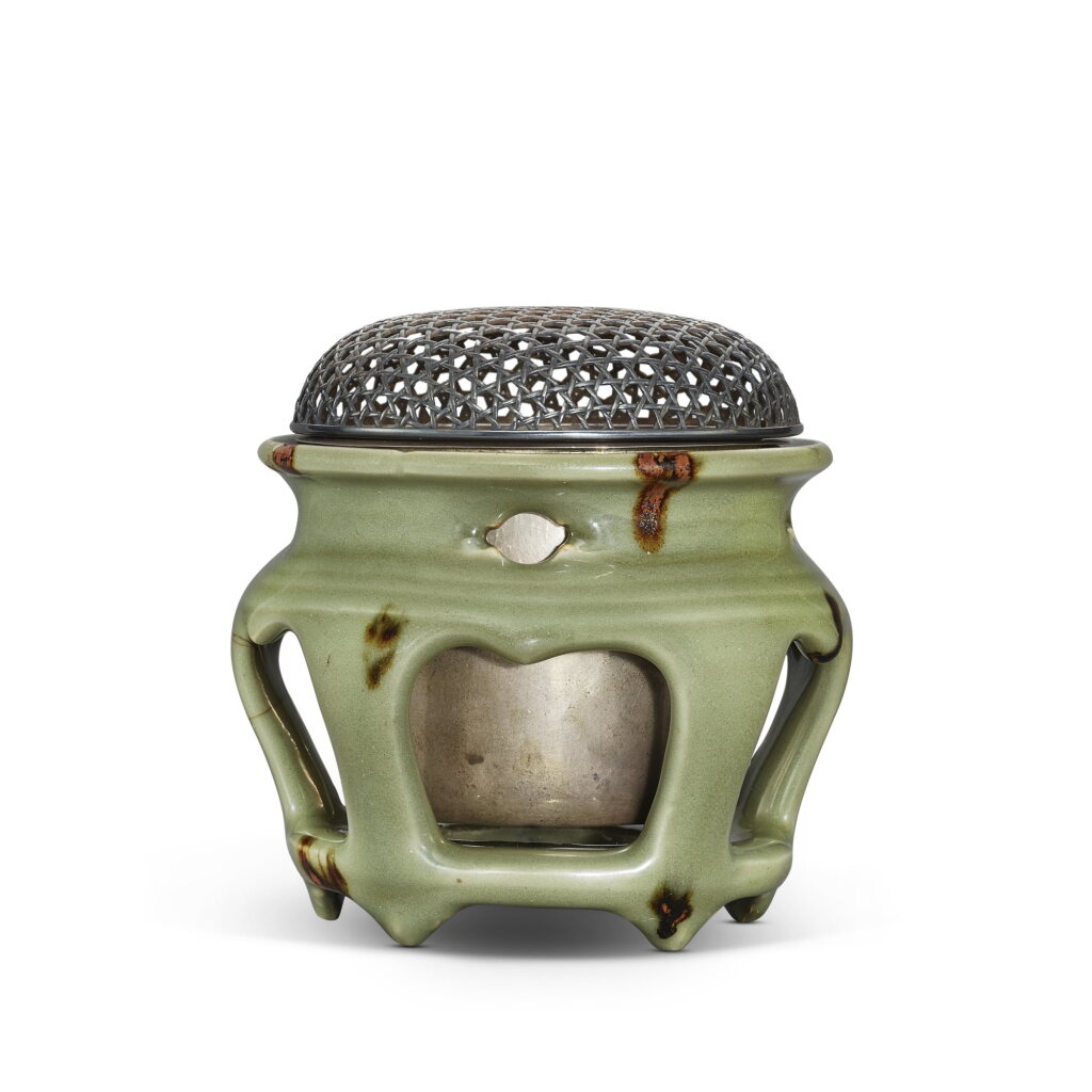 View full screen - View 1 of Lot 363. A Longquan celadon 'tobi seiji' stand, Yuan - Ming dynasty 元至明 龍泉青釉褐斑鏤空器座.