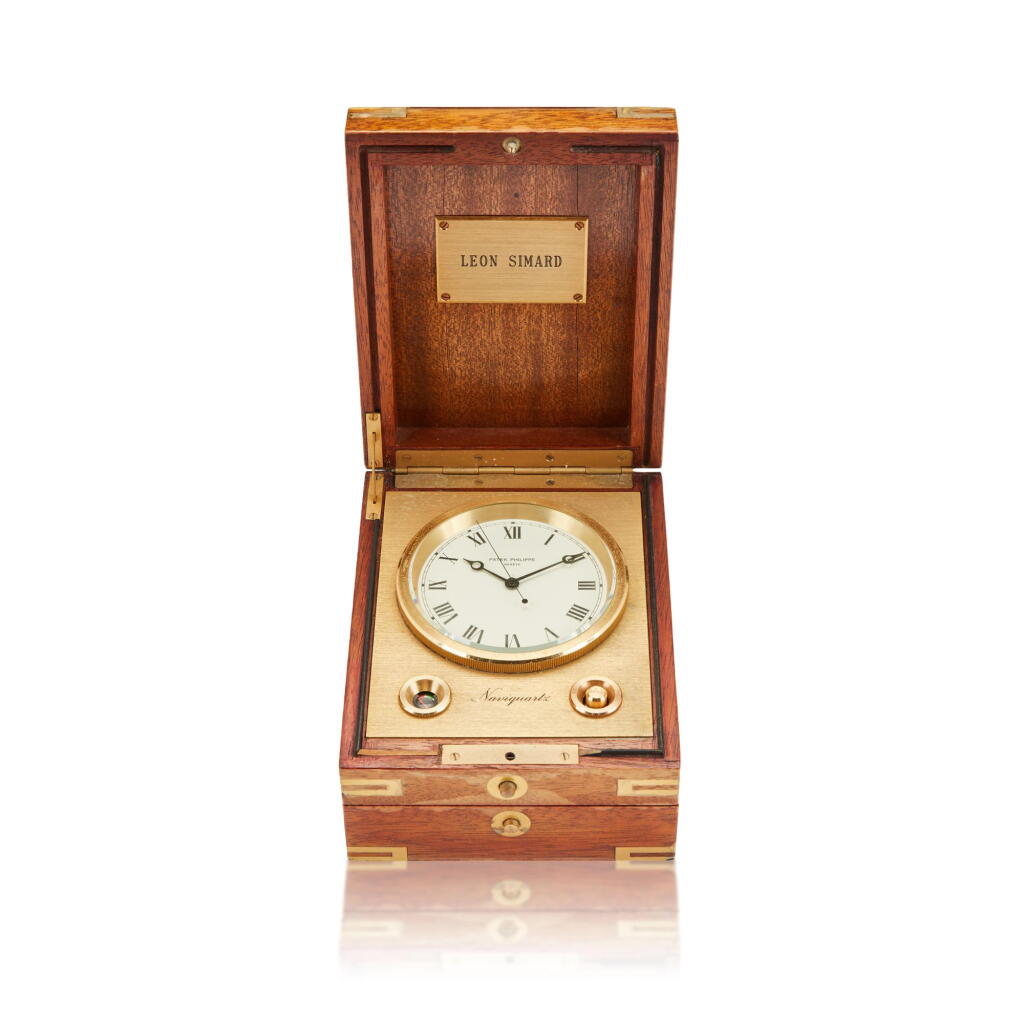 View full screen - View 1 of Lot 127. Reference 1215 Naviquartz, A gilt brass table clock with wooden box, Circa 1980.