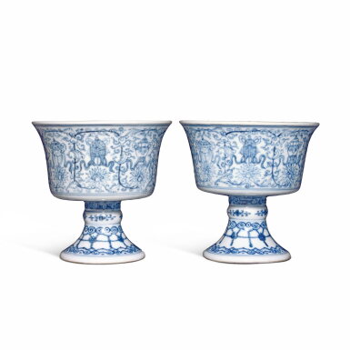 View full screen - View 1 of Lot 380. A pair of blue and white 'Eight Buddhist Emblems' stem cups, Marks and period of Qianlong | 清乾隆 青花蓮托八吉祥紋高足杯一對 《大清乾隆年製》款.