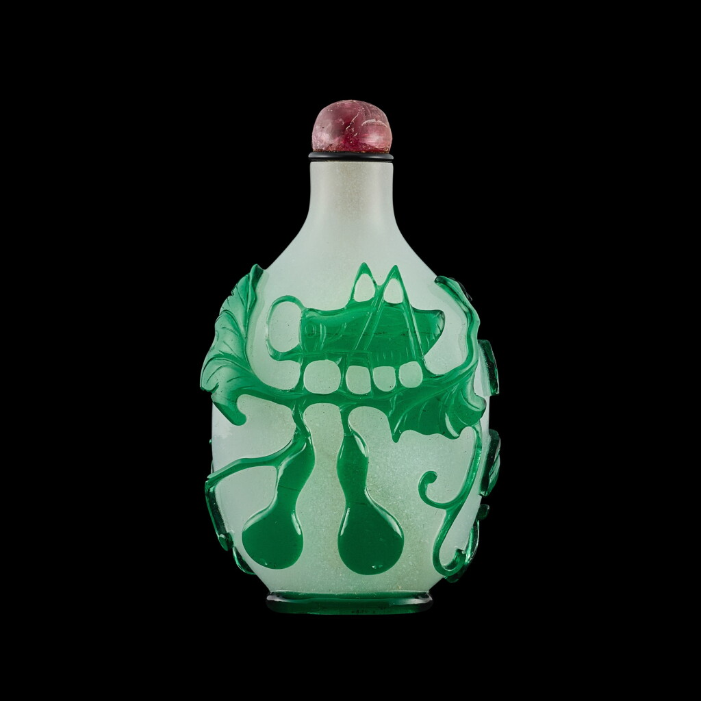 View full screen - View 1 of Lot 1017. A green overlay glass 'cricket and praying mantis' snuff bottle, Qing dynasty, Daoguang period | 清道光 珍珠地套綠料螳螂蟋蟀圖鼻煙壺.