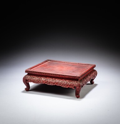 View full screen - View 1 of Lot 46. A small carved cinnabar lacquer table, Qing dynasty, 17th - 18th century | 清十七至十八世紀 剔紅花卉紋小方桌.