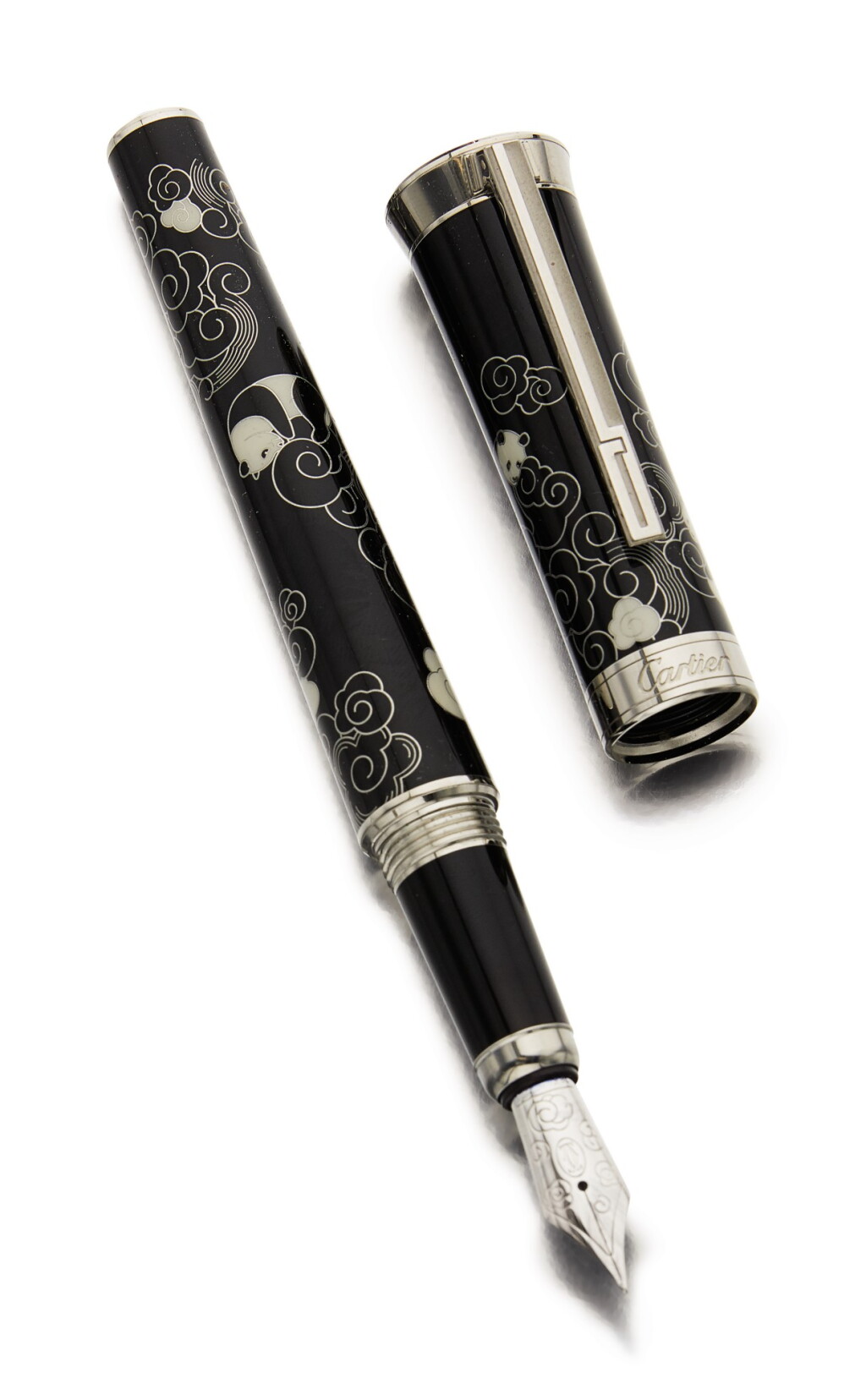 View full screen - View 1 of Lot 44. CARTIER | A LIMITED EDITION BLACK LACQUERED AND PALLADIUM FINISHED FOUNTAIN PEN DEPICTING PANDA BEARS, CIRCA 2011.
