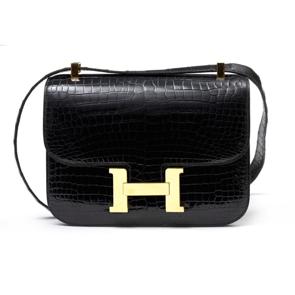 View full screen - View 1 of Lot 1048. Noir Shiny Crocodile Porosus Constance 24 Gold Hardware, 1996 .