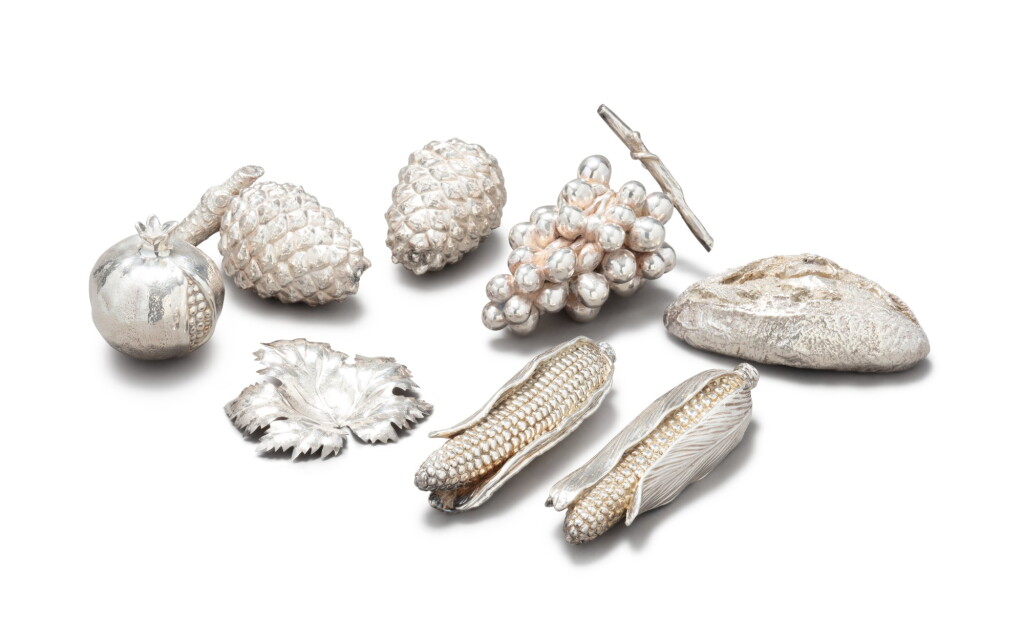 View full screen - View 1 of Lot 22. A group of eight silver fruits, leaf and bread, Florence and Milan, 20th century | Groupe de huit fruits, feuille et pain en argent, Florence et Milan, XXe siècle.