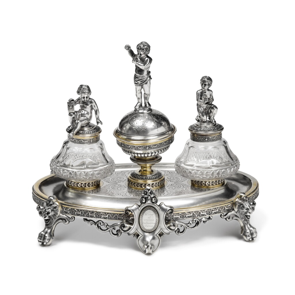 View full screen - View 1 of Lot 244. A Swedish Parcel-Gilt Silver Figural Inkstand, maker's mark GM, Stockholm, 1881.