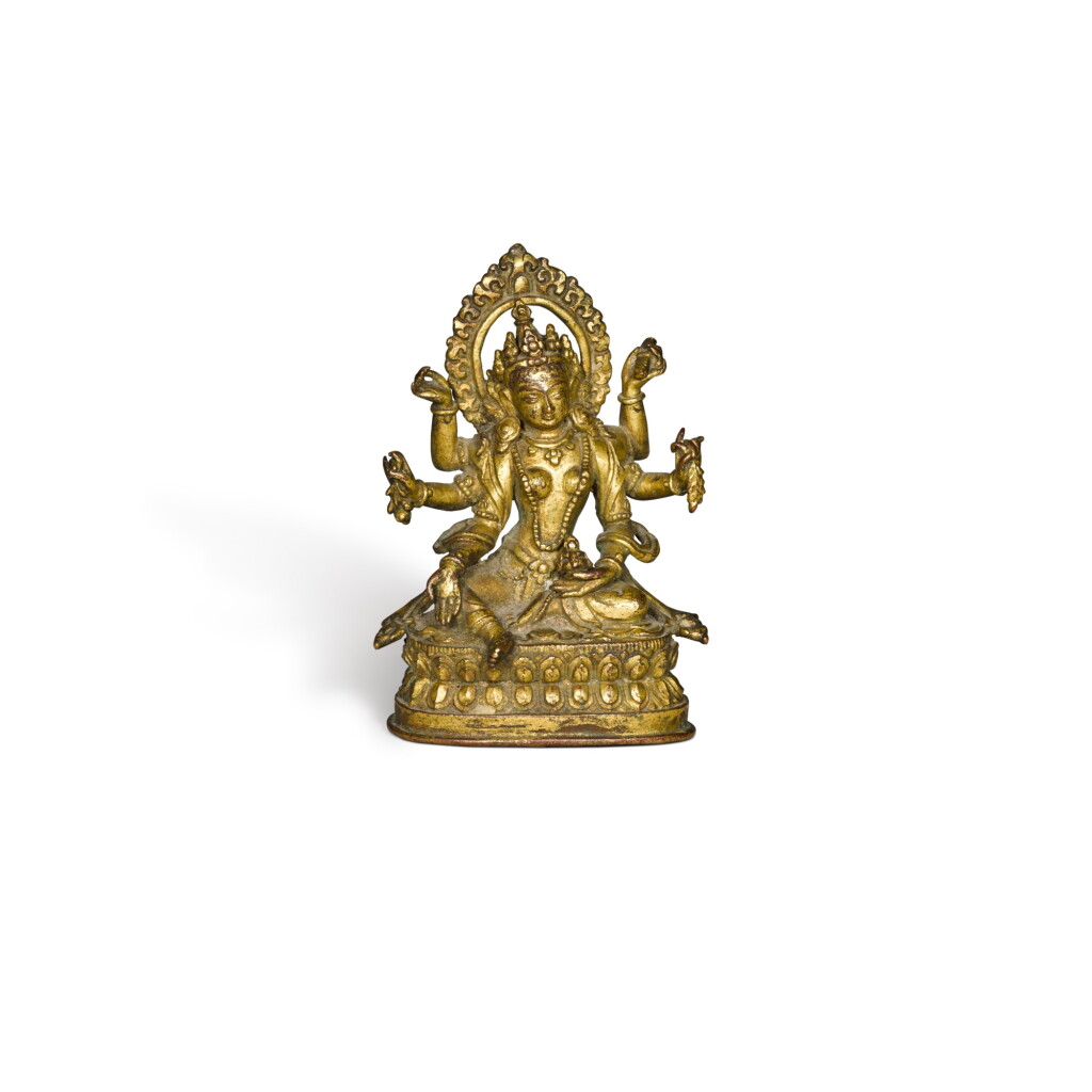 View full screen - View 1 of Lot 119. A gilt copper alloy figure of Vasudhara, Nepal, 18th century.