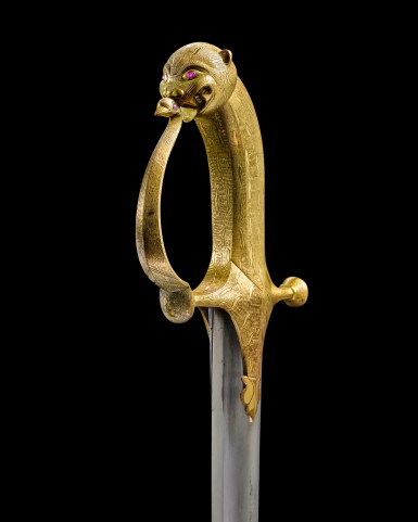 View full screen - View 1 of Lot 95. An important gilt-mounted sword with ruby eyes and scabbard from Tipu Sultan's armoury, India, Seringapatam, circa 1782-99.