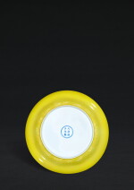 A rare and moulded lemon-yellow enamelled charger, Mark and period of Yongzheng | 清雍正 檸檬黄彩印海水紋折腰盤 《大清雍正年製》款