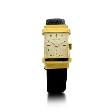 View full screen - View 1 of Lot 153. PATEK PHILIPPE | REFERENCE 1450 'TOP HAT' A YELLOW GOLD RECTANGULAR WRISTWATCH, MADE IN 1949.
