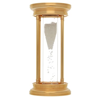 View full screen - View 1 of Lot 189. DE BEERS | GOLD-PLATED HOURGLASS WITH FLOATING DIAMONDS CIRCA 2000.